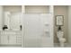 Bright bathroom with a shower and tub, a white vanity, and ample storage at 2149 Albatross Nest Dr, Bartow, FL 33830