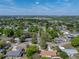 Wide aerial view of the property highlighting the residential area and mature landscaping at 501 15Th Ne Ct, Winter Haven, FL 33881