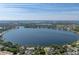 Magnificent aerial view of lake, beautiful community, and waterfront properties at 501 15Th Ne Ct, Winter Haven, FL 33881