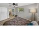 Bedroom with mirrored closet doors, natural light, and neutral decor at 501 15Th Ne Ct, Winter Haven, FL 33881