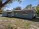 Well-maintained blue brick home with manicured lawn on a sunny day at 501 15Th Ne Ct, Winter Haven, FL 33881