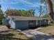 Charming single-story home featuring a well-maintained yard, brick facade, and inviting walkway leading to the front door at 501 15Th Ne Ct, Winter Haven, FL 33881