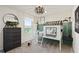 Whimsical bedroom with a playful bed, green paneling and a view of the lake at 1423 Hamilton Way, Lake Alfred, FL 33850