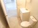 This bathroom showcases a toilet, sink, and tiled flooring at 308 Summer Field Dr, Winter Haven, FL 33880