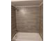 Featuring tile shower and tub at 308 Summer Field Dr, Winter Haven, FL 33880