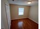Bedroom featuring hardwood floors, a closet and natural light from the window at 308 Summer Field Dr, Winter Haven, FL 33880