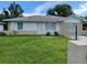 Charming single-story home with a well-maintained lawn and neutral color palette exterior at 308 Summer Field Dr, Winter Haven, FL 33880