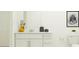 Bright bathroom with a white vanity, decorative accents, and a toilet at 1177 Hour Glass Rd, Lakeland, FL 33801