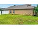 Spacious backyard with lush green grass and a white fence, perfect for relaxation and entertaining at 3035 Buckeye Pointe Dr, Winter Haven, FL 33881