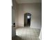 Bright entryway with tile floors, neutral walls, and arched doorway leading to other parts of the home at 3035 Buckeye Pointe Dr, Winter Haven, FL 33881