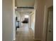 Hallway with archways leading to living spaces, featuring tile flooring and natural light at 3035 Buckeye Pointe Dr, Winter Haven, FL 33881