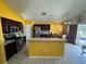 Open layout featuring a kitchen with island, stainless steel appliances and dining area at 3035 Buckeye Pointe Dr, Winter Haven, FL 33881