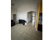 Open concept living room with neutral tile flooring, high ceilings and an open arched doorway at 3035 Buckeye Pointe Dr, Winter Haven, FL 33881