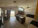 Open-concept living space with kitchen island, seamless transition to dining, and inviting living area at 3035 Buckeye Pointe Dr, Winter Haven, FL 33881