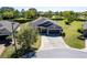 Spacious home with three-car garage, large driveway, and landscaped surroundings at 6898 Sw 95Th Cir, Ocala, FL 34481