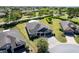 Aerial view featuring the single-story house with a well-manicured lawn in a golf community at 6898 Sw 95Th Cir, Ocala, FL 34481
