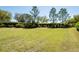 Expansive backyard featuring a well-maintained lawn and mature landscaping for added privacy at 6898 Sw 95Th Cir, Ocala, FL 34481