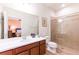 Spacious bathroom with double sinks, vanity, a glass-enclosed shower and toilet at 6898 Sw 95Th Cir, Ocala, FL 34481