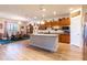 Bright kitchen with a center island, stainless steel appliances, and seamless transition to the dining and living areas at 6898 Sw 95Th Cir, Ocala, FL 34481