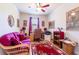 Bright office space featuring a plush sofa, ceiling fan, and a window with natural light, perfect for working from home at 6898 Sw 95Th Cir, Ocala, FL 34481