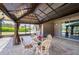 Spacious covered patio with brick flooring, offering outdoor relaxation and entertainment at 6898 Sw 95Th Cir, Ocala, FL 34481