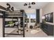 Sports themed bedroom with black furniture, soccer accents, and natural light, creating a unique and inviting space at 1687 Ruby Ln, Lake Alfred, FL 33850