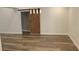 Finished basement area with barn door, modern lighting, and wood-look flooring; perfect for recreation at 3821 Whitedove Dr, Lakeland, FL 33812