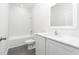 Stylish bathroom featuring modern fixtures, white cabinets, and sleek countertops at 13438 Leaping Water Way, Astatula, FL 34705
