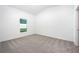 Clean bedroom with carpet flooring, a window, and a minimalist design at 13438 Leaping Water Way, Astatula, FL 34705