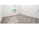 Bright bedroom featuring neutral carpet and a window bringing in natural light at 13438 Leaping Water Way, Astatula, FL 34705