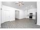 Spacious open-concept living and kitchen area with hardwood floors and ample natural light at 13438 Leaping Water Way, Astatula, FL 34705