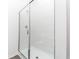 Modern bathroom shower with a glass door and sleek white tiled walls at 13438 Leaping Water Way, Astatula, FL 34705