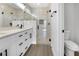 Modern bathroom featuring dual sinks, quartz counters, and a glass-enclosed shower at 2840 Sw 166 Th Ln, Ocala, FL 34473