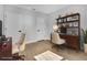 Home office space featuring a wooden desk, chair and shelving unit at 2840 Sw 166 Th Ln, Ocala, FL 34473