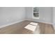 Cozy bedroom featuring wood floors and a sunny window at 2840 Sw 166 Th Ln, Ocala, FL 34473