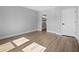 Bedroom with wood flooring, a gray accent wall and attached bathroom at 2840 Sw 166 Th Ln, Ocala, FL 34473