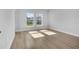Bedroom with wood flooring and two large windows at 2840 Sw 166 Th Ln, Ocala, FL 34473