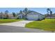 Charming single-story home featuring a well-manicured lawn and a two-car garage bathed in natural light at 2840 Sw 166 Th Ln, Ocala, FL 34473