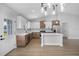 Well-lit kitchen with white and wood cabinetry, stainless steel appliances, and a central island perfect for entertaining at 2840 Sw 166 Th Ln, Ocala, FL 34473