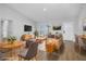 Comfortable living room with modern furnishings, wood floors, and ample natural light, creating a cozy and stylish space at 2840 Sw 166 Th Ln, Ocala, FL 34473