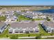 An aerial view of a meticulously planned community with a calming lake nearby at 3926 Grassland Dr, Orlando, FL 32824