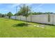 A spacious backyard with privacy wall and lush green grass at 3926 Grassland Dr, Orlando, FL 32824
