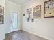 Bright entryway featuring wood-look tile flooring and natural light from the front door at 3926 Grassland Dr, Orlando, FL 32824