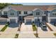 Beautiful townhome featuring private garages and manicured landscaping at 3926 Grassland Dr, Orlando, FL 32824