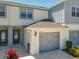 Lovely townhome exterior with private garage and manicured landscaping at 3926 Grassland Dr, Orlando, FL 32824