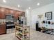 Kitchen with stainless steel appliances, granite countertops, dark wood cabinets, and wood-look floors at 3926 Grassland Dr, Orlando, FL 32824