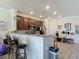 Bright kitchen features granite countertops, wood cabinetry, and a breakfast bar for convenient dining at 3926 Grassland Dr, Orlando, FL 32824