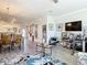 Open-concept living area that flows into the dining room, perfect for Gathering gatherings and entertaining guests at 3926 Grassland Dr, Orlando, FL 32824