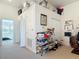 Spacious loft area with ample storage, built-in shelving, and a view into the bedroom at 3926 Grassland Dr, Orlando, FL 32824