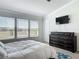 Spacious main bedroom with carpet, dresser, and windows providing natural light and pleasant outdoor views at 3926 Grassland Dr, Orlando, FL 32824